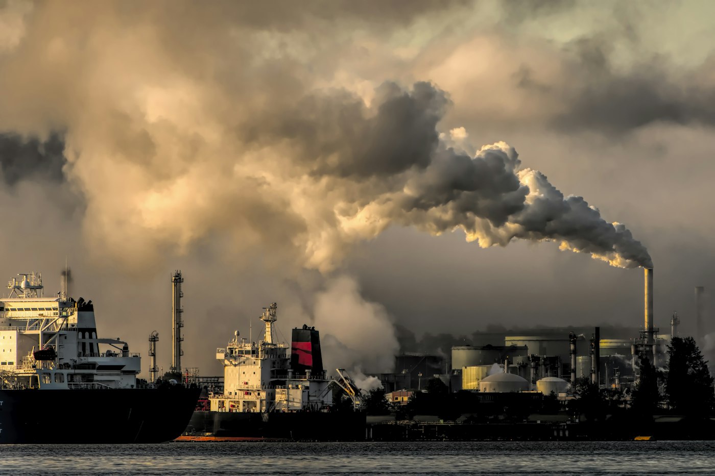 Industrial plant and tanker at a waterfront