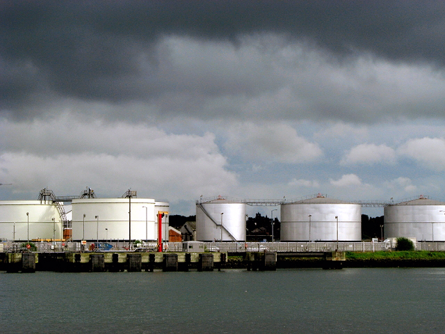 Oil storage tanks beside a harbour