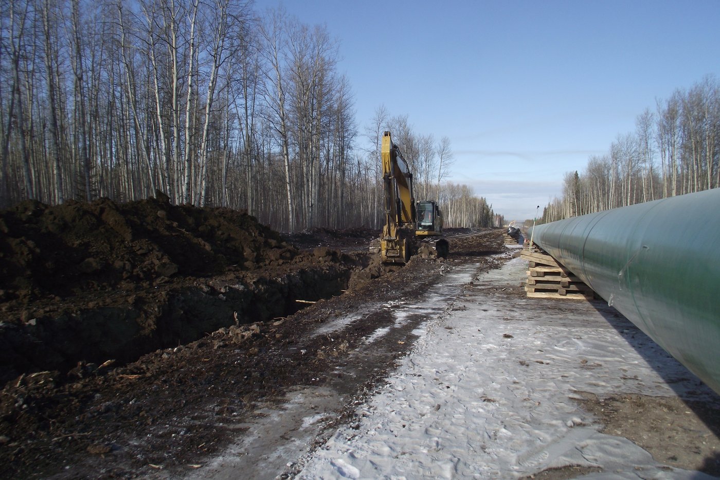 Pipeline construction through open ground
